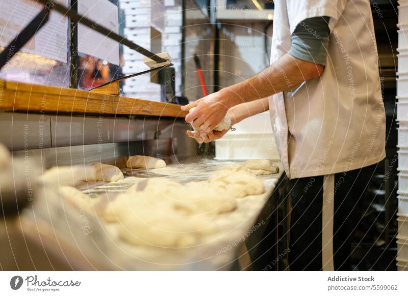 Baker's hands kneading close-up unrecognizable dough baker bakery flour work cook people traditional baking preparation making occupation muslim food portrait