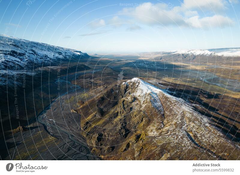 Aerial of snowy mountains ridge in Thorsmork view cap valley Icelandic highland nature outdoor scenic beauty tranquil wilderness terrain cold travel destination