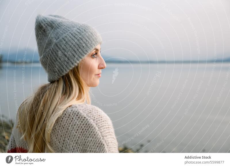 Side view of woman looking away against lake person female young nature water adult portrait leisure lifestyle happy one standing caucasian vacation lonely face