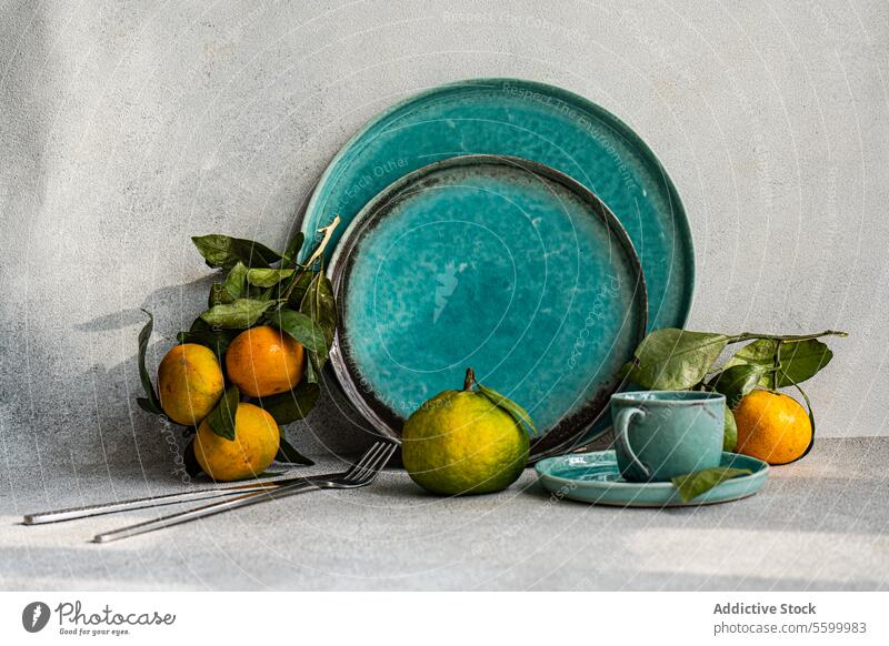 Turquoise Table Setting with Citrus turquoise table setting citrus fresh fruit dining atmosphere tableware ceramic inviting decor style home color arrangement