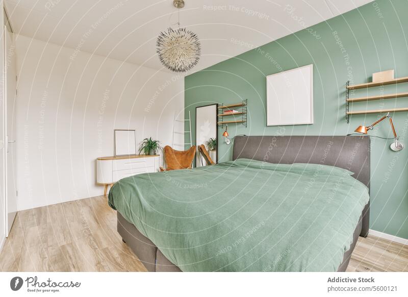 Bedroom with green wall and bed bedroom large comfortable spacious house home chair mirror dresser shelf pendant lamp hanging frame white ladder copy space