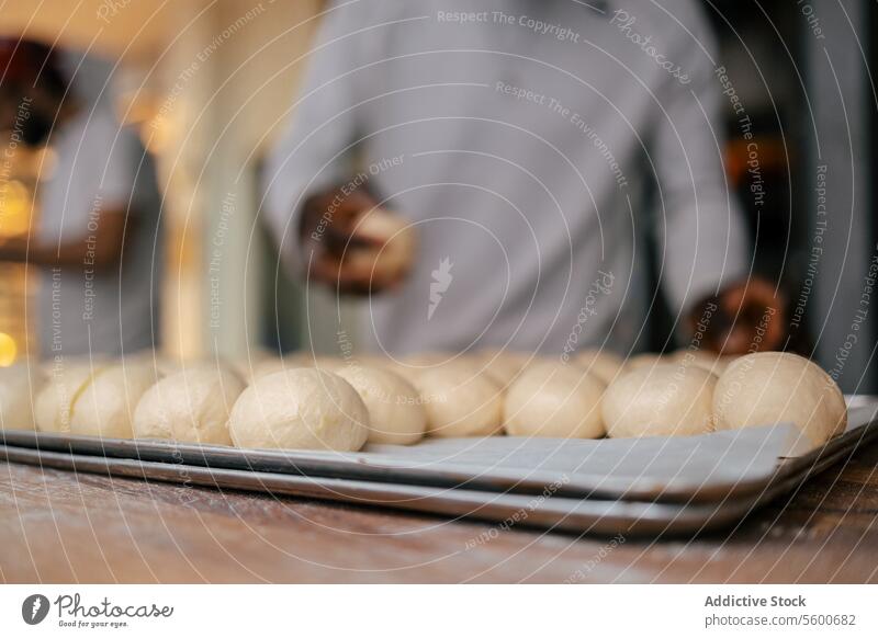 Portrait of dough balls portrait close-up bread baker bakery tray food flour wheat fresh yeast tasty business production making preparing working bakehouse