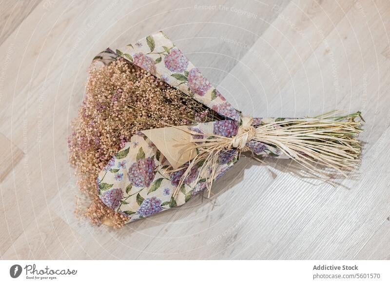 Handmade Lavender Bouquet on Wooden Floor handmade bouquet lavender dried flower floral paper wooden wrapped decoration craft rustic aromatic natural gift