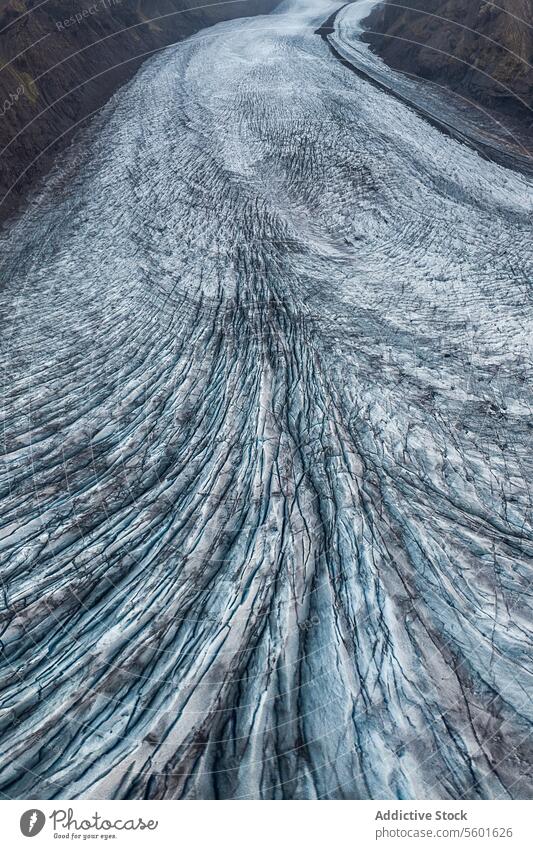 Glacier flow aerial texture valley ice blue pattern cold natural geology frozen winter topography outdoors remote wild nature Arctic ecology altitude landscape