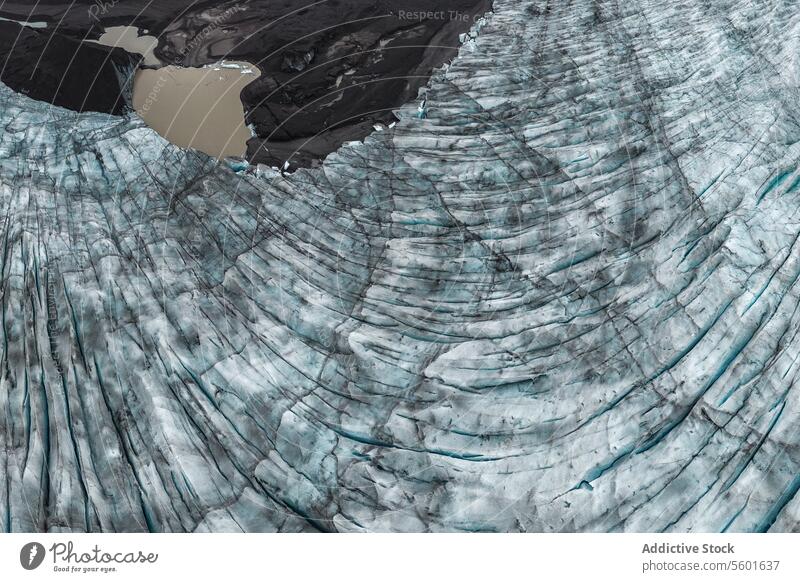 Aerial view of ice cap and muddy sea glacier aerial iceberg winter weather nature scenic arctic cold water seaside vatnajokull iceland texture national park