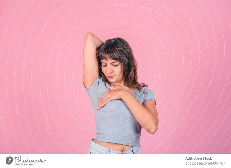 Woman doing a Breast Self-Exam over pink background BSE Breast Cancer Awareness Breast Cancer Month Breast cancer prevention Breast health Mammogram