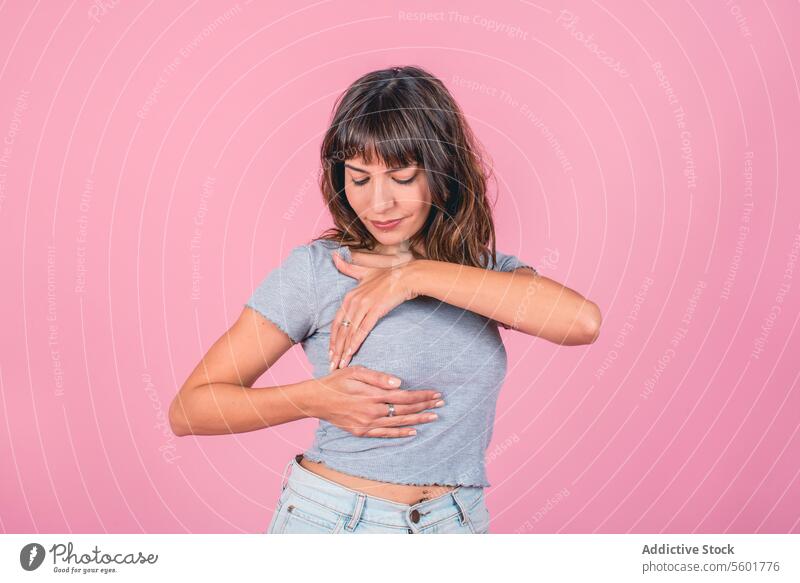 Woman doing a Breast Self-Exam (BSE). Breast Cancer Awareness Breast Cancer Month Breast cancer prevention Breast health Mammogram Pink Ribbon Day aid awareness