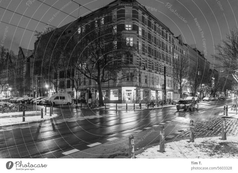 Winter night at an intersection in Prenzlauer Berg Night b/w Snow chestnut avenue Oderberger Street Berlin Town Capital city Downtown Old town Exterior shot