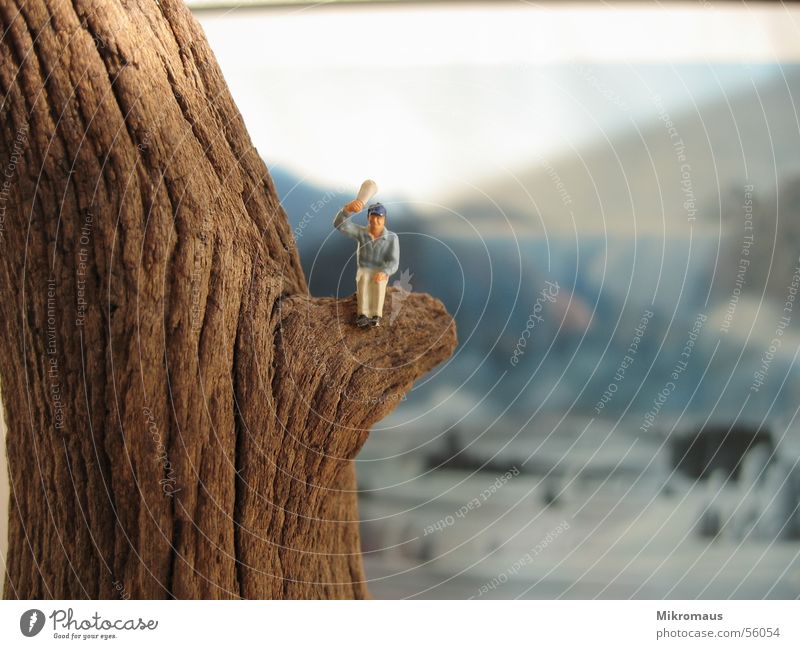 air snapper Manikin Railroad Toys Figure Mountain Wave Wood Tree trunk Background picture Painting and drawing (object) Image Salutation Above Air Newspaper Sit