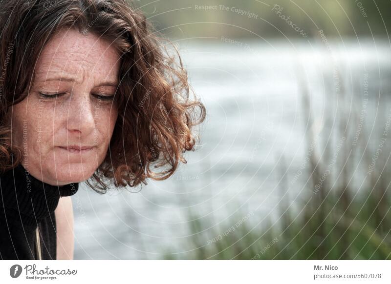 woman Hair and hairstyles naturally emotionally Emotions Dream Meditative silent Sadness Longing portrait Closed eyes Calm River Lake Face Curl Freckles