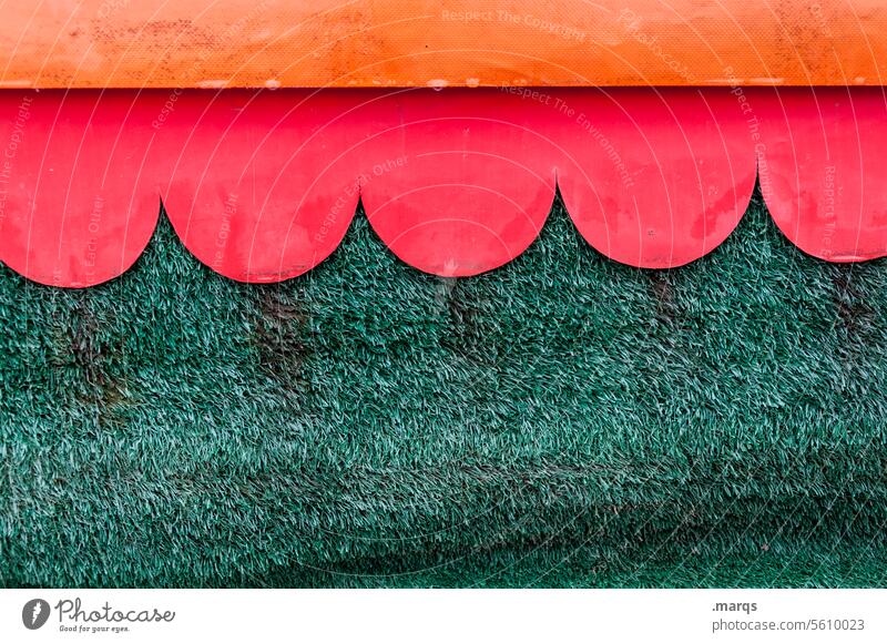 Awning on artificial turf Artificial lawn Structures and shapes Disk Red Green Orange Close-up Abstract Sun blind Background picture