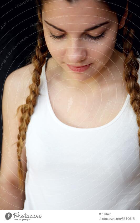 young lady Meditative reserved Downward lower head portrait Long-haired Youth (Young adults) Girl Hair and hairstyles Plaited Braids Feminine Smiling Face