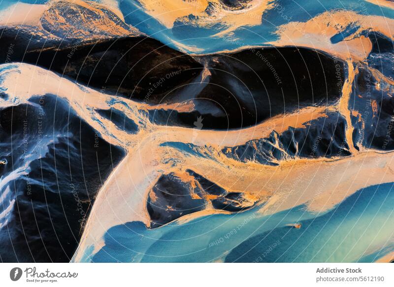 Aerial view of braided river patterns in Iceland iceland aerial view natural flow water sediment nature artistry abstract texture intricate landscape
