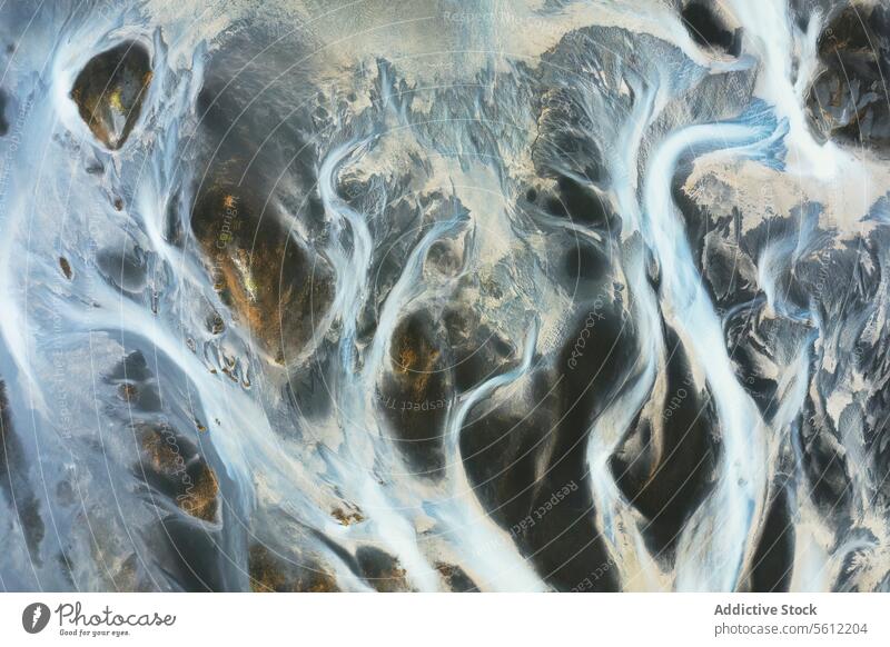 Aerial view of Iceland's intricate river patterns iceland aerial view river basin abstract nature flow water stream geology landscape natural beauty environment