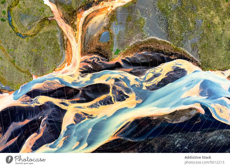 Aerial view of an Icelandic river basin's intricate patterns iceland aerial view abstract beauty vivid color water flow dynamic masterpiece nature landscape