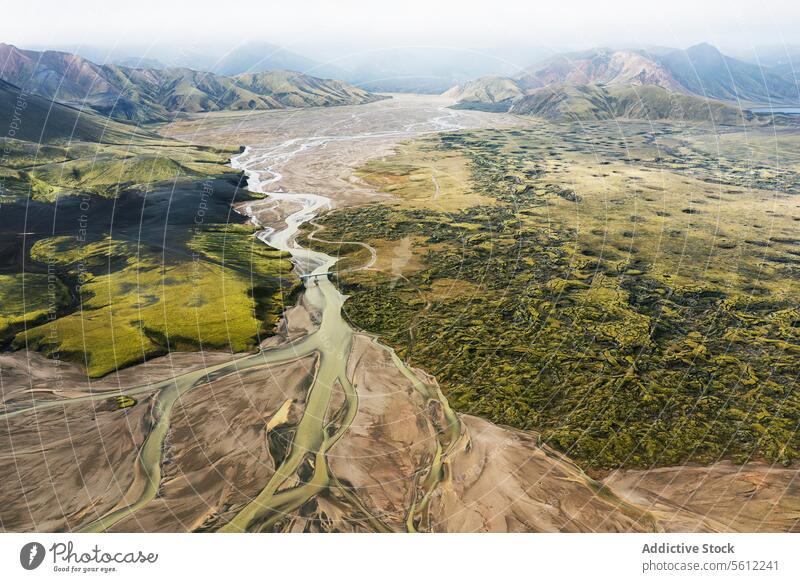 Aerial view of Icelandic river basins and lush terrain iceland aerial view landscape greenery nature outdoors scenic wild water flow vibrant natural beauty