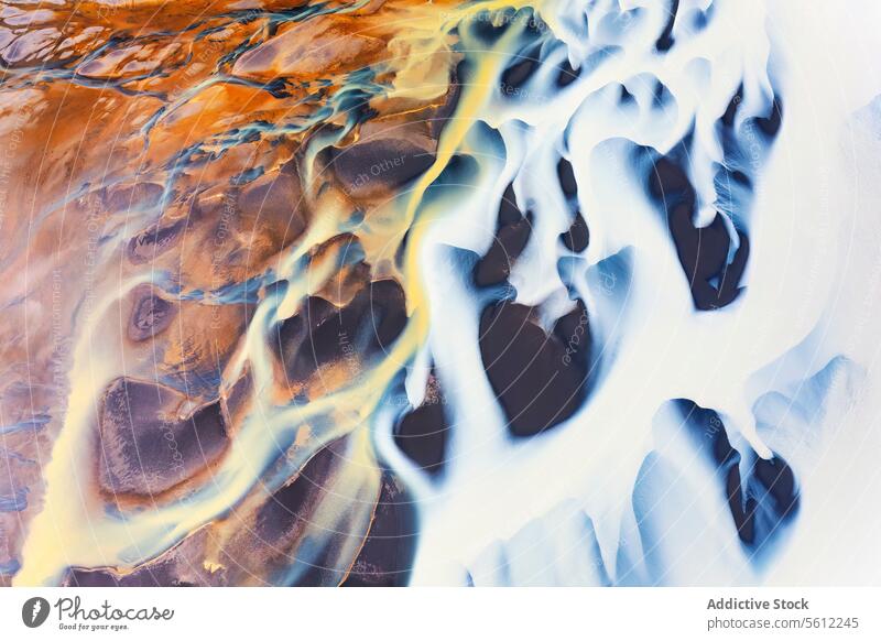 Aerial view of a serene Icelandic river basin iceland aerial landscape nature tranquil beauty contrast color texture water flow natural pattern abstract