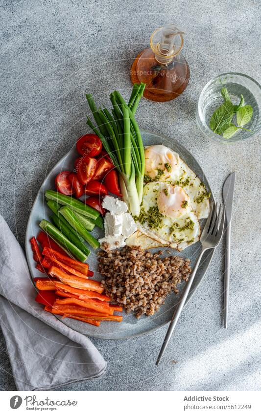 Healthy Breakfast Plate with with Vegetables, Cheese and Eggs with Pesto breakfast healthy fresh vegetables cherry tomato cucumber green onion red bell pepper