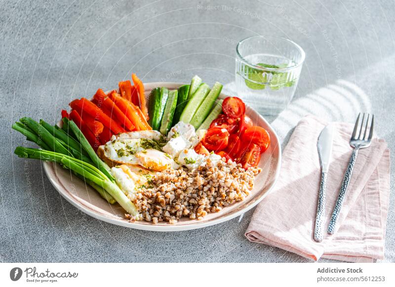 Colorful and nutritious 7-ingredient breakfast concept with Vegetables, Cheese and Eggs healthy cherry tomato mini cucumber green onion red bell pepper