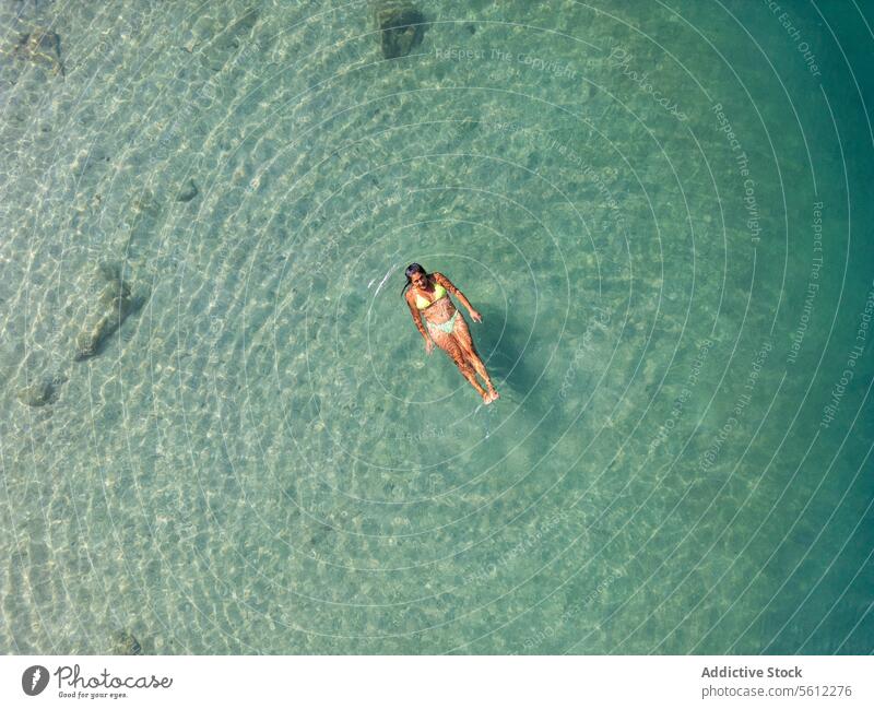 Aerial view of a person floating in the clear waters of Nice aerial view turquoise sea nice cÃ´te d'azur france relaxation summer leisure travel holiday
