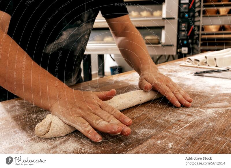 Hands of chef kneading bread dough in bakery cook table flour kitchen hand crop anonymous bakehouse pastry unrecognizable wooden body part handmade raw cuisine