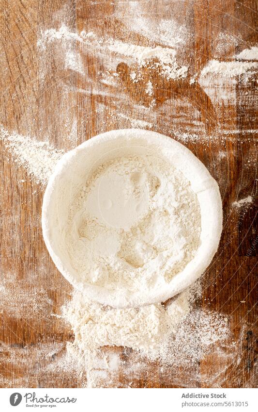 Closeup of flour in bowl at bakery table kitchen bakehouse mess wooden cooking process raw white ingredient food fresh prepare cuisine recipe culinary product