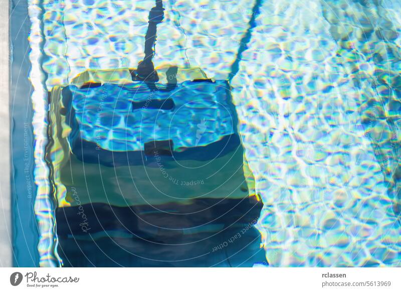 robot pool cleaner. Pool maintenance with automatic robot. cleaner the bottom of the pool and walls with a submersible robot. Summer pool cleaning robot before swimming. vacuum cleaner