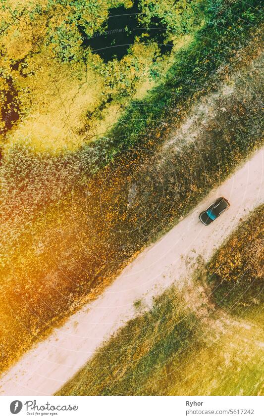 Aerial View Of Car SUV Parked Near Countryside Road, Summer Field Rural Landscape near bog marsh swamp scene crossover road beautiful view landscape country suv