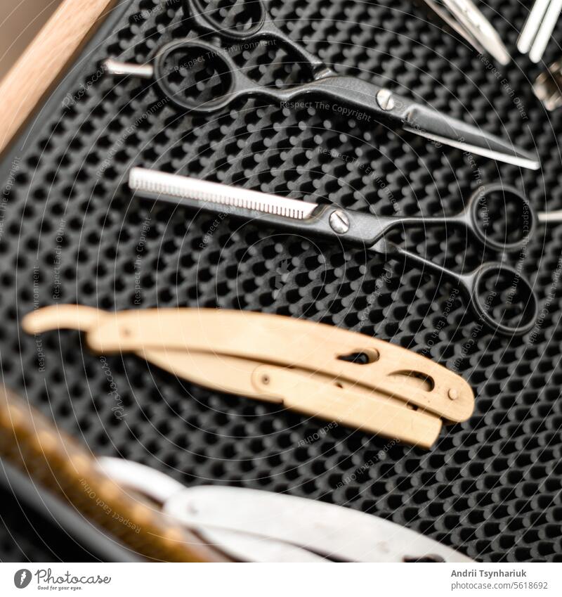Barbers tools for mens haircuts laid out on a table dangerous razor scissors set barber professional barbershop fashion hairdresser background comb equipment