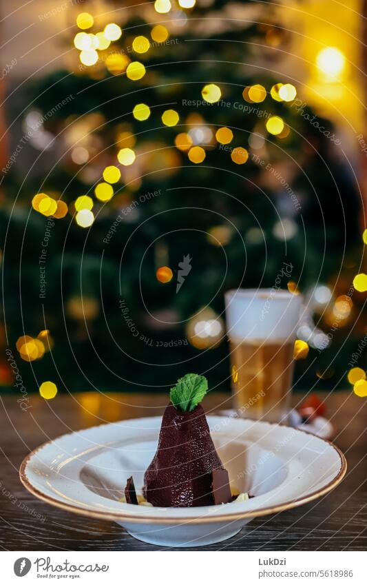 Christmas dessert with coffee agains blurred Christmas tree in background Advent Delicious sweets indoor food celebration Christmas & Advent Colour Colour Image