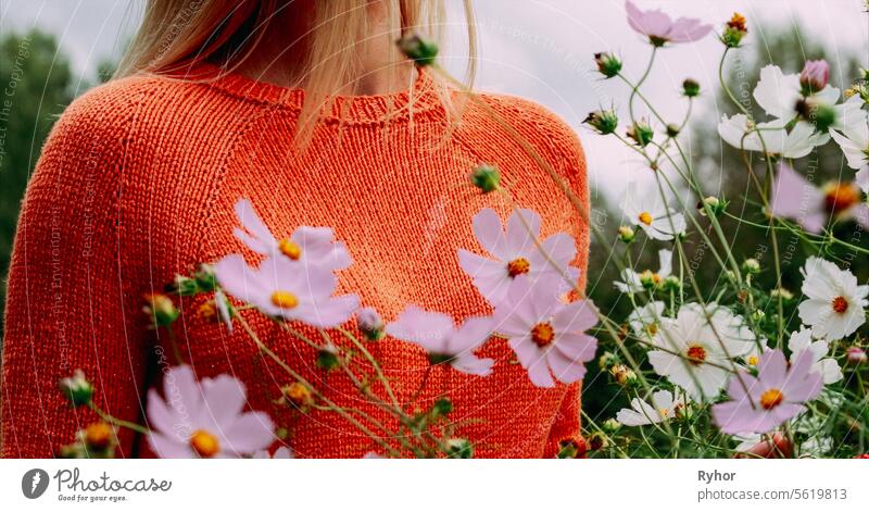 Young Pretty Caucasian Happy Girl Woman In Woolen Jacket Blouse At Flowers Field. Self Confidence. Calmness And Tranquility. Healthy Lifestyle Concept. Stress Less. Practice Mindfulness