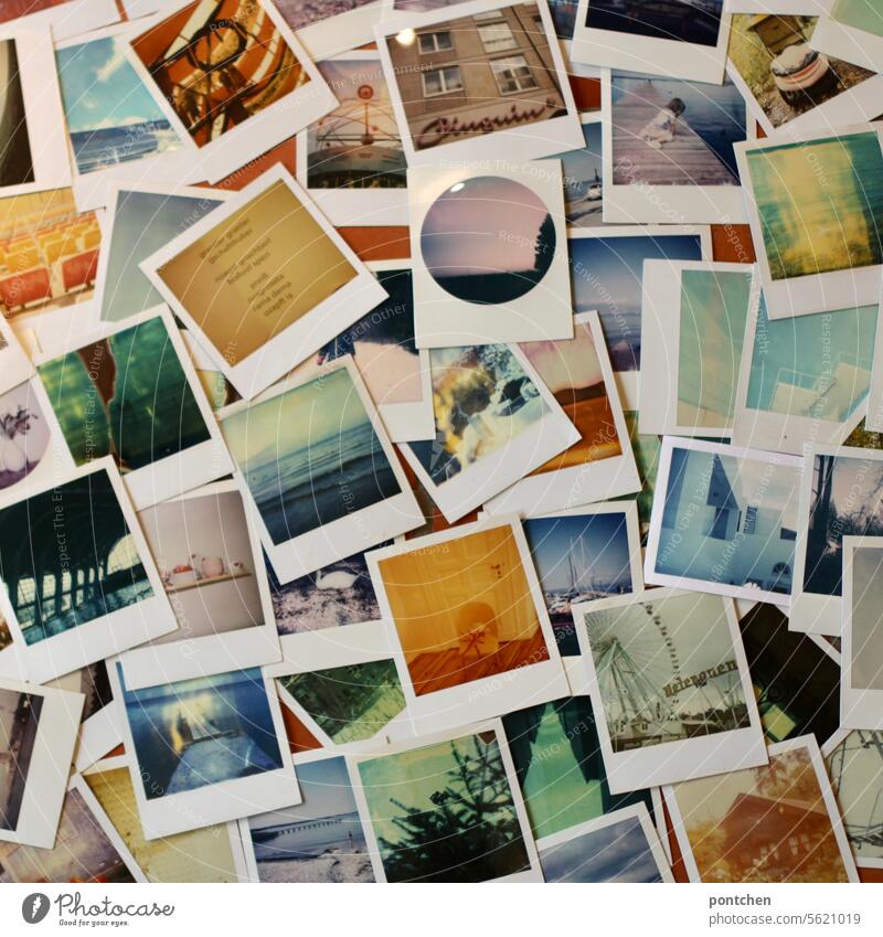 Many Polaroid photographs lie on the floor. Memories, hobby. Photographs Collection Memory Colour photo Past Nostalgia Analog Sentimental Retro Flat