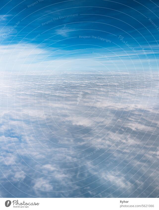 Beautiful View Of Sunny Sky Above White Fluffy Clouds From Height Flight Of Plane. horizon view nature copy space evening sky plane sunny cloudscape landscape