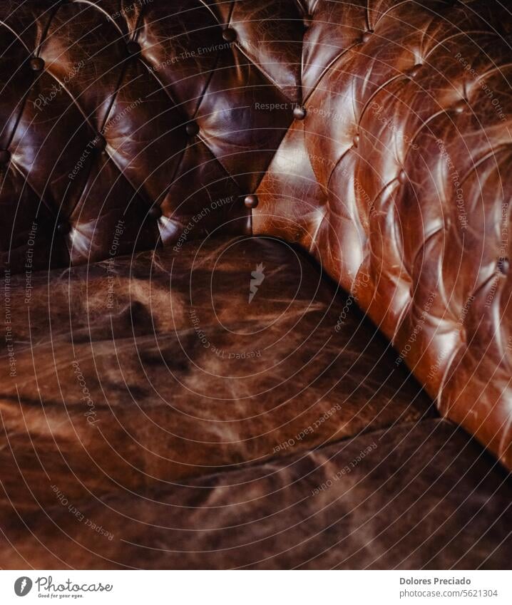 Brown leather upholstery of the typical chester sofa abstract antique armchair background brown classic closeup clothing color comfort comfortable contemporary