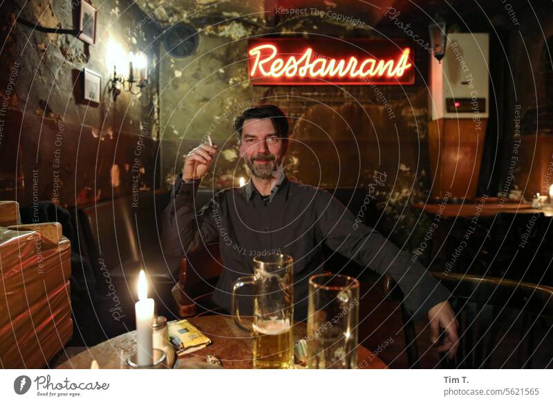 Man with a cigarette in a restaurant Cigarette Restaurant Berlin Colour photo Smoking Human being portrait Smoke Face Nicotine Hand Tobacco products Unhealthy