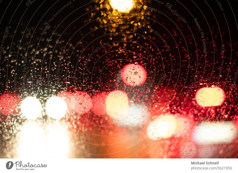Traffic lights in the rain Rain raindrops Wet Drops of water Water Close-up Bad weather Weather Damp Rainy weather poor visibility Autumn Reflection Transport