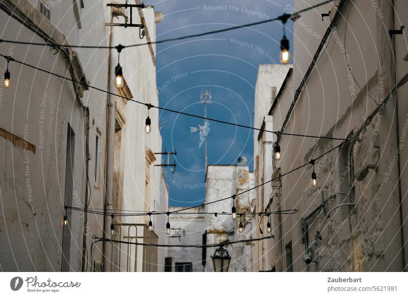 Street lighting above the road between medieval houses in Ostuni Streetlight Sky Medieval times Apulia Zigzag picturesque Town Light Lighting Lantern Lamp