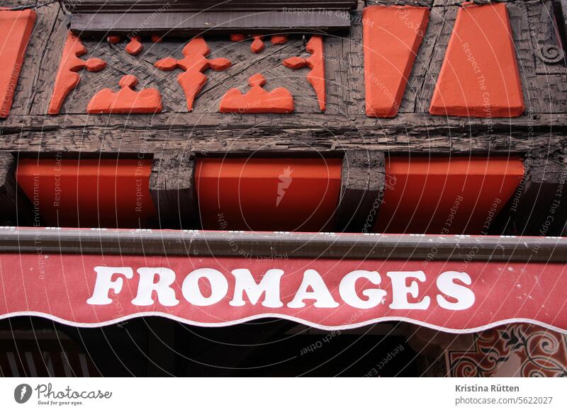 formages stands on the awning of the cheese store fromages Cheese Lettering Sun blind writing Letters (alphabet) Advertising typo typography Facade Architecture