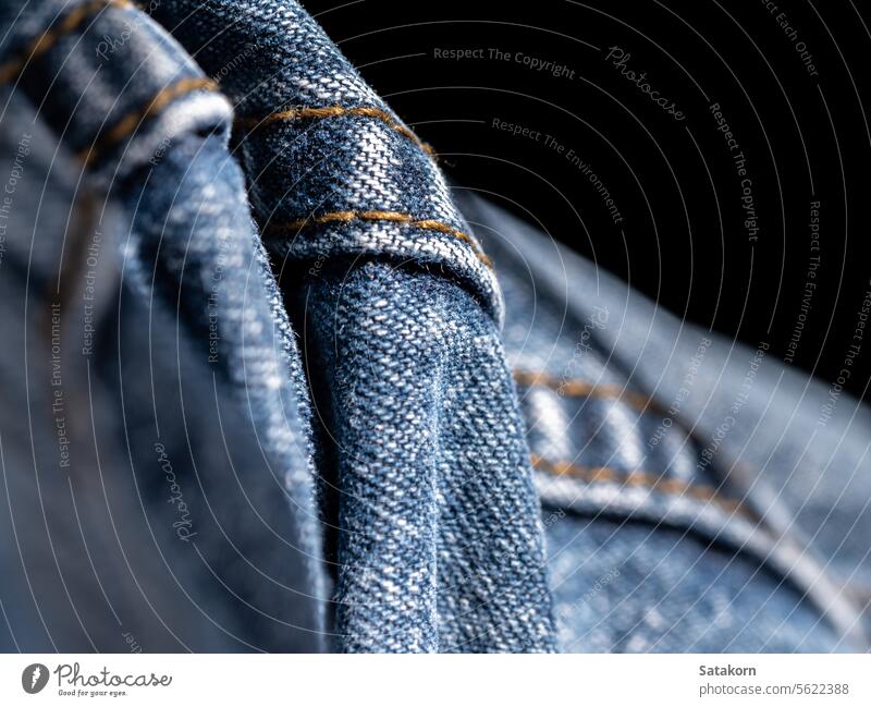 Texture and seam of denim fabric jeans blue textile pants casual pattern background close up clothing garment old detail color fashion object trousers texture