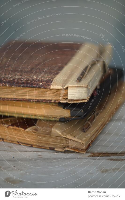 Old notebooks Book Notebook vintage Paper Bookbinder Diary Deserted Colour photo Analog crafted handcrafted Memory Write Stack Brown Close-up blurriness Moody