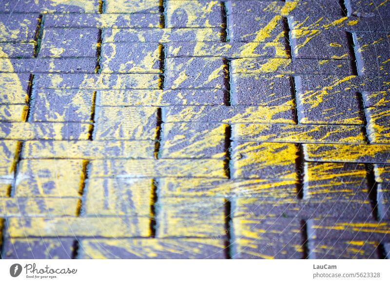 !Trash! 2023 | yellow color on asphalt Yellow blotchy paint splashes Asphalt paving Paving stone Cobblestones Street Patch Accident Adversity Smeared Sidewalk