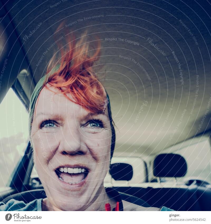 Have fun! - Woman in the car, her hair tousled by the wind, laughing enthusiastically Middle aged woman Human being Adults Colour photo portrait Face 1 Happy