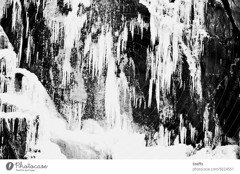 View of a frozen waterfall in Iceland Waterfall East Iceland Frozen Freeze Cold chill Icicle Freezing icy cold water Hoar frost quick-frozen Rock iced White