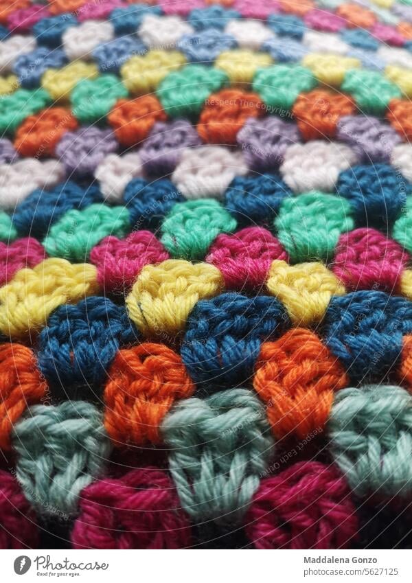 Multi coloured crochet texture background crocheted bachground multi colour multicoloured colorful yarn textile wool woolen warm soft winter handmade handcraft