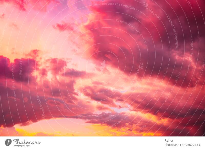 Sunrise bright dramatic sky. Scenic colorful sky at dawn. Sunset sky natural abstract background in pink purple red yellow colors scenic beautiful tranquil
