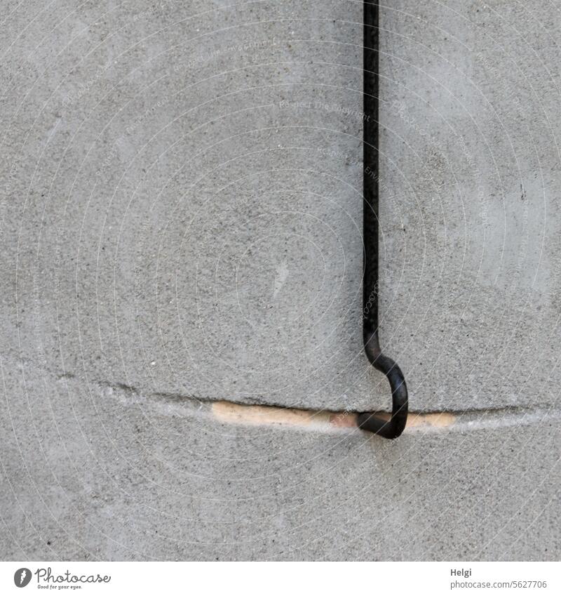 !Trash! 2023 | A constant hook wears away the stone Wall (building) Wall (barrier) Checkmark trace Concave Metal Stone Deserted Colour photo Exterior shot
