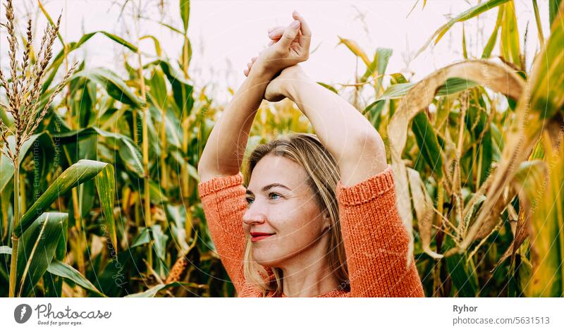 Portrait Of Young Pretty Caucasian Happy Girl Woman At Summer Cornfield. Healthy Lifestyle Concept. Unity With Nature. Calmness And Tranquility. Yoga Concept Lifestyle. Mental Health Conception