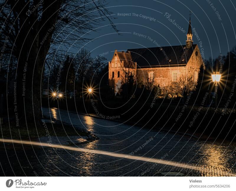 St. Martin's Church in Zetel at night believe Dark Frisia Lower Saxony evangelical-lutheran Rain Wet clearer Illuminated streetlamp Lantern Paving stone
