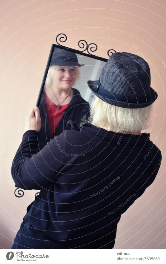 Meet yourself in the mirror every morning with joy and respect Mirror Mirror image Woman young girl Blonde Hat look in the mirror self-reflection