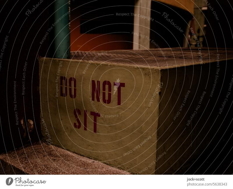 NOT SITTING Word do not sit air shaft Signs and labeling forbidden English Authentic Low-key Capital letter Typography Neutral Background Pillar Concrete Corner